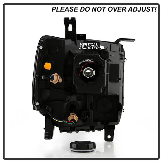 Rear housing view of the replacement headlight for 2014-2019 GMC Sierra models, showing the Vertical Adjuster knob and warning label against over-adjusting.